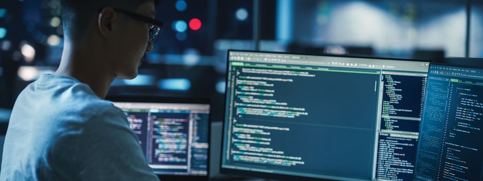 Man-working-on-desktop-coding-h